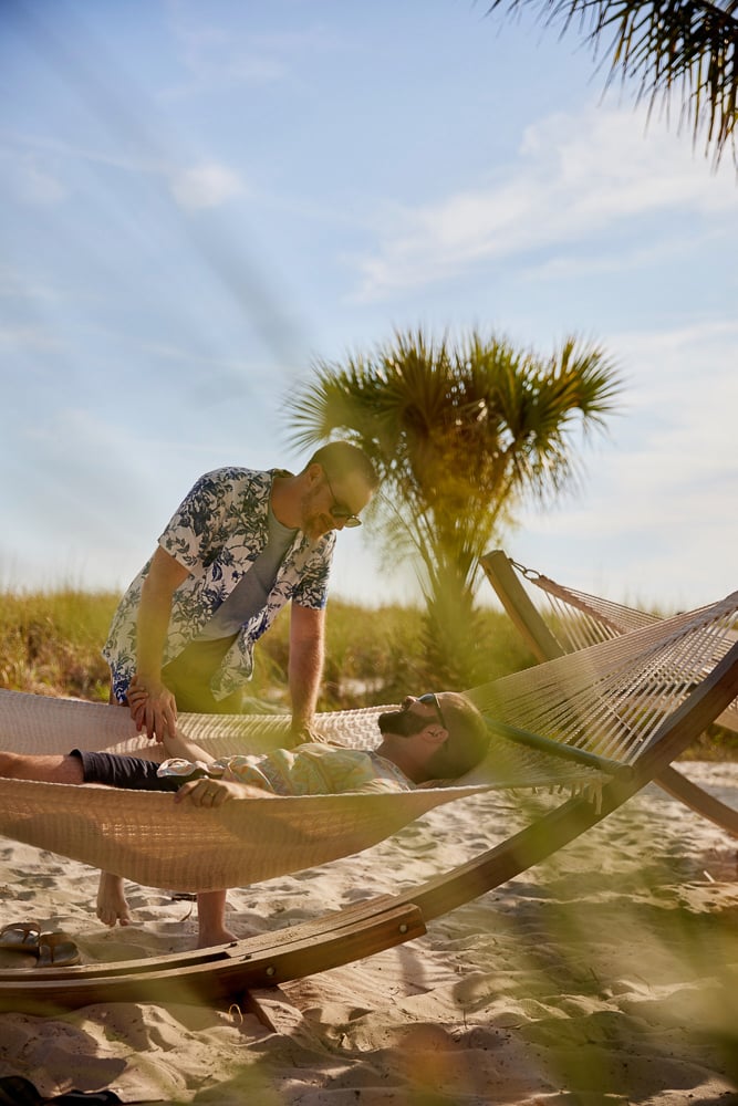 Photo of a gay couple relaxing at a beach in St Petersburg or Clearwater. 