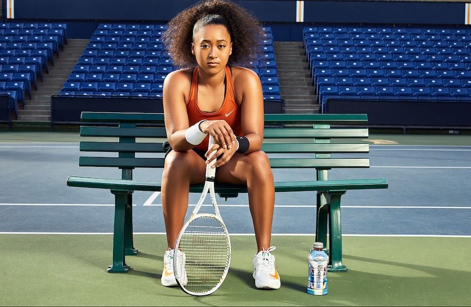 Portrait of tennis player seated with racket, by Los Angeles fitness photographer Travis McCoy.