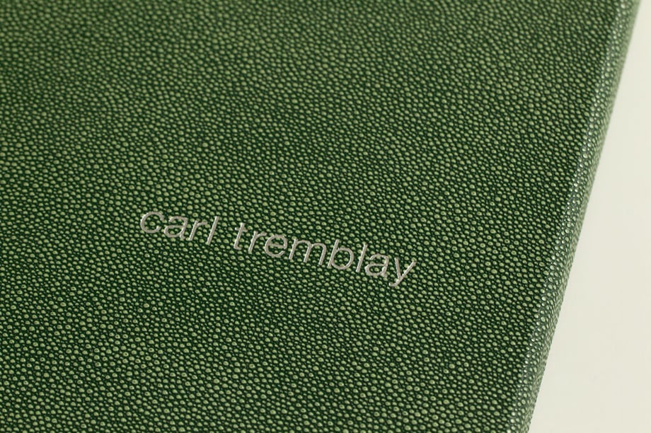 Cover binding of Carl Tremblay's print portfolio.