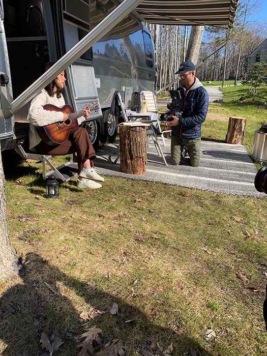 BTS of Trent Bell and Willow Zhu in front of Airstream trailer making music video.