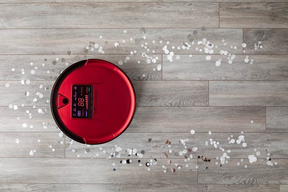 Aerial photo of a red bobsweep vacuum cleaner taken by Toronto-based product photographers Becca Gilgan and Eugen Sakhnenko of Worker Bee Supply. 