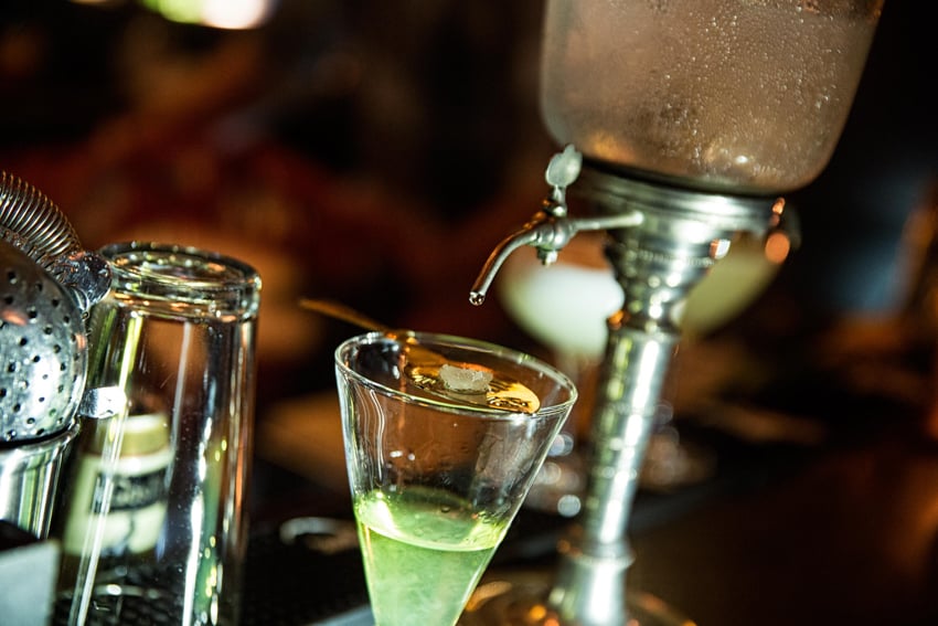 A glass of absinthe shot by Lou Bopp.