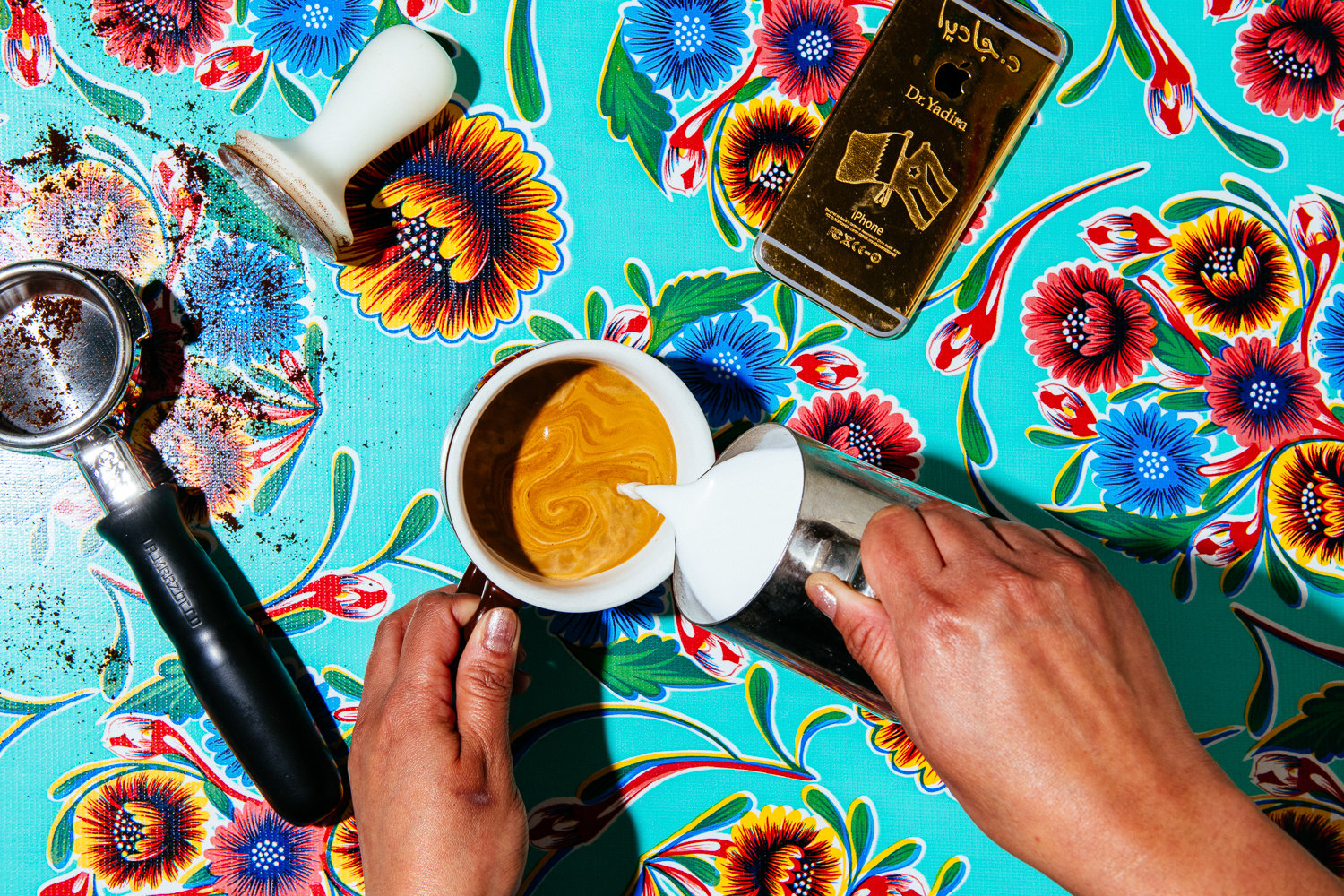 Lauren V. Allen's perfectly timed photo of Yadira's latte creation against a bright, flowery table