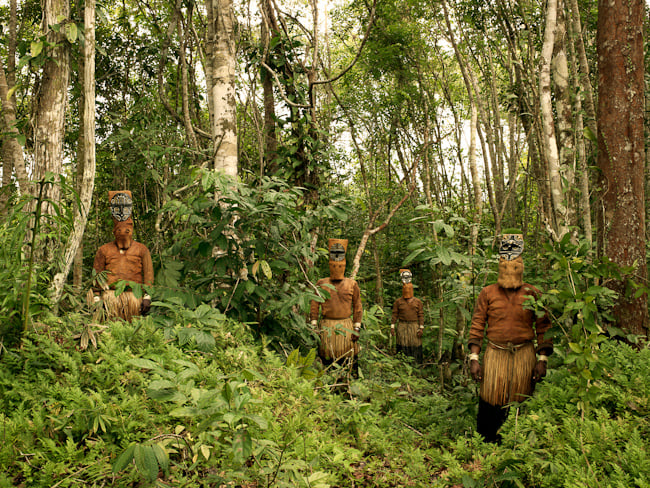 Yucuna tribesmen dressed for the Baile del Muneco or Puppet Dance, shot by London-based photojournalist Piers Calvert