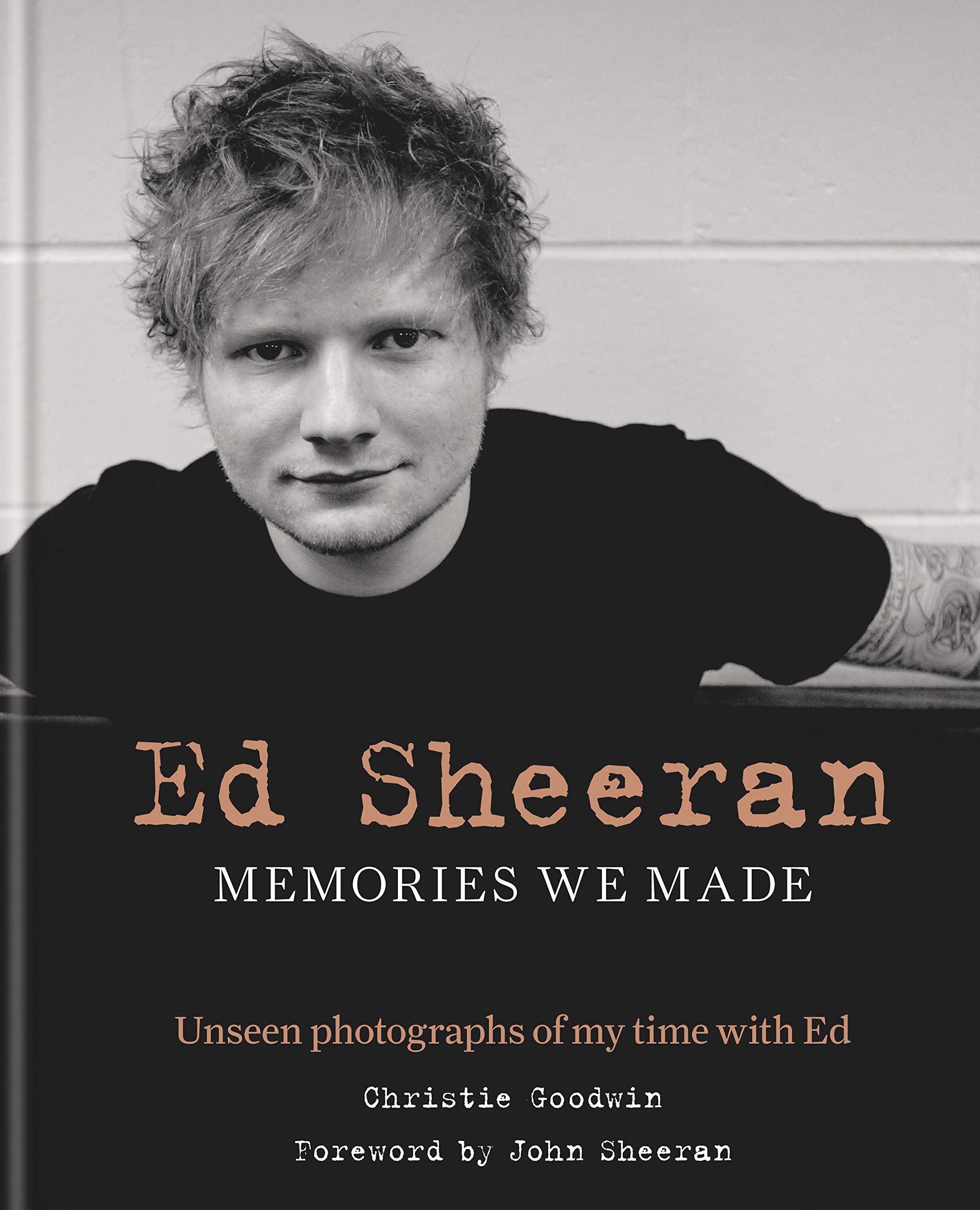 Tear of Christie Goodwin's portrait of Ed Sheeran on the cover of her book, "Ed Sheeran: memories we made"