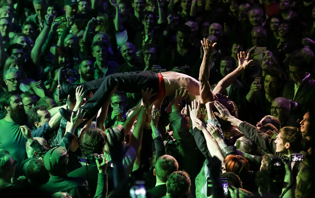 Christie Goodwin captures a shirtless Iggy Pop crowd surfing at a Royal Albert Hall show in 2016