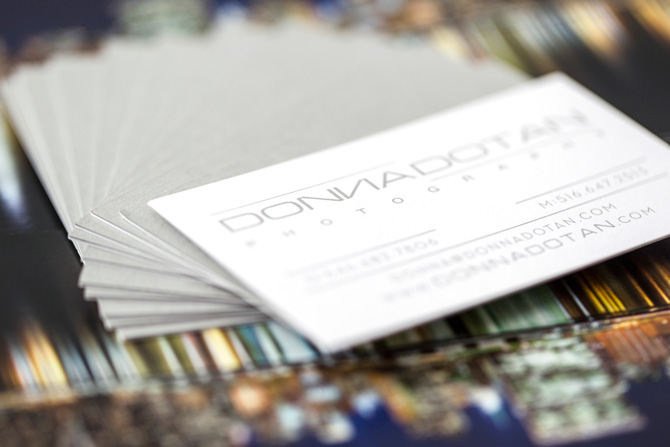 Donna Dotan business cards on top of books