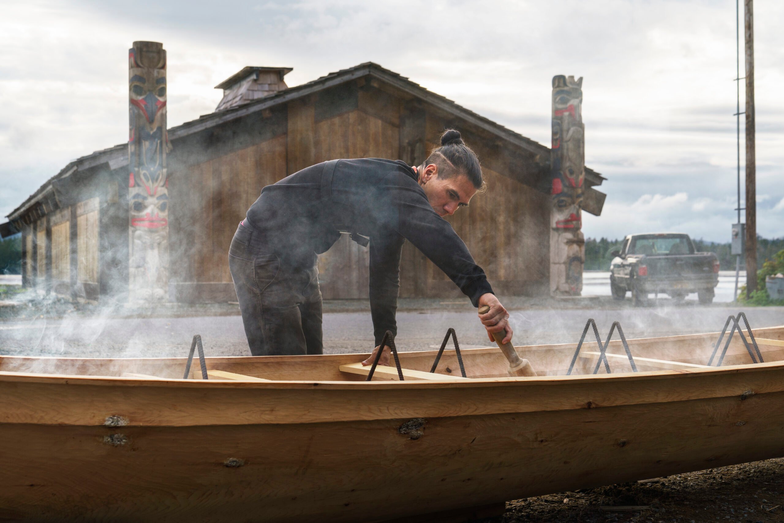 An artist works on a boat. Photography by Fernando Decillis for Smithsonian Magazine