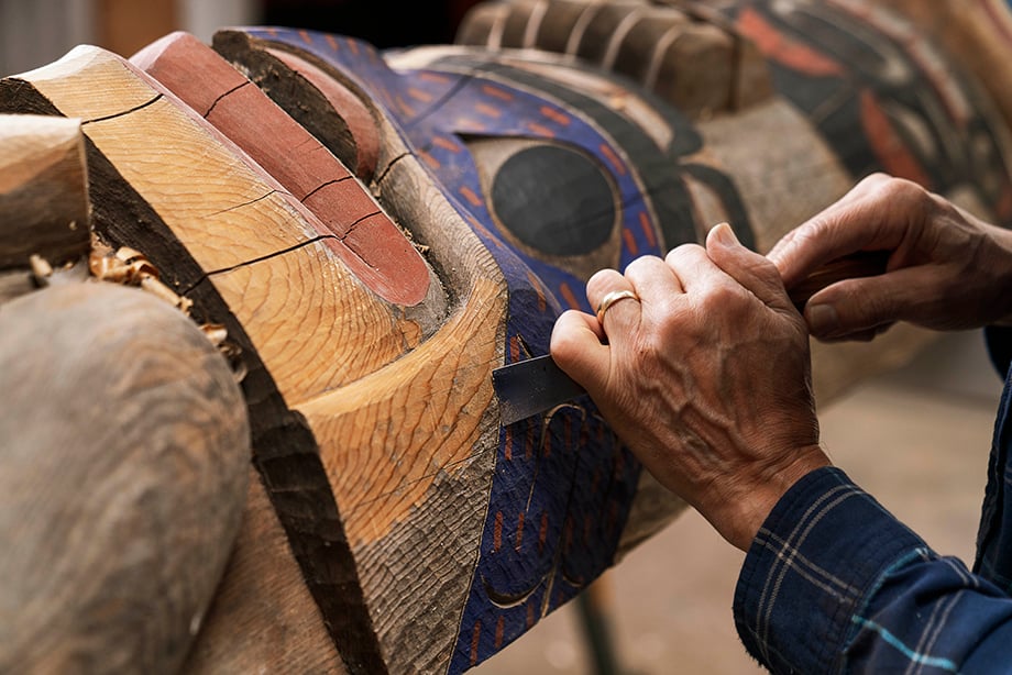 Close up image of artist carving. Photography by Fernando Decillis for Smithsonian Magazine