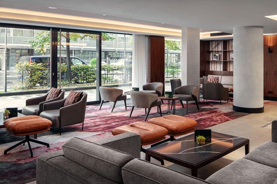 Jiri Lizler photographs dining area in front of floor to ceiling windows for the Marriott Hotel
