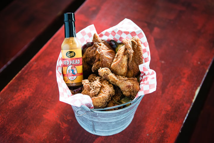 A mouthwatering photo that captures a bucket filled with fried chicken from Lucy's Fried Chicken restaurant. Photo by John Davidson.