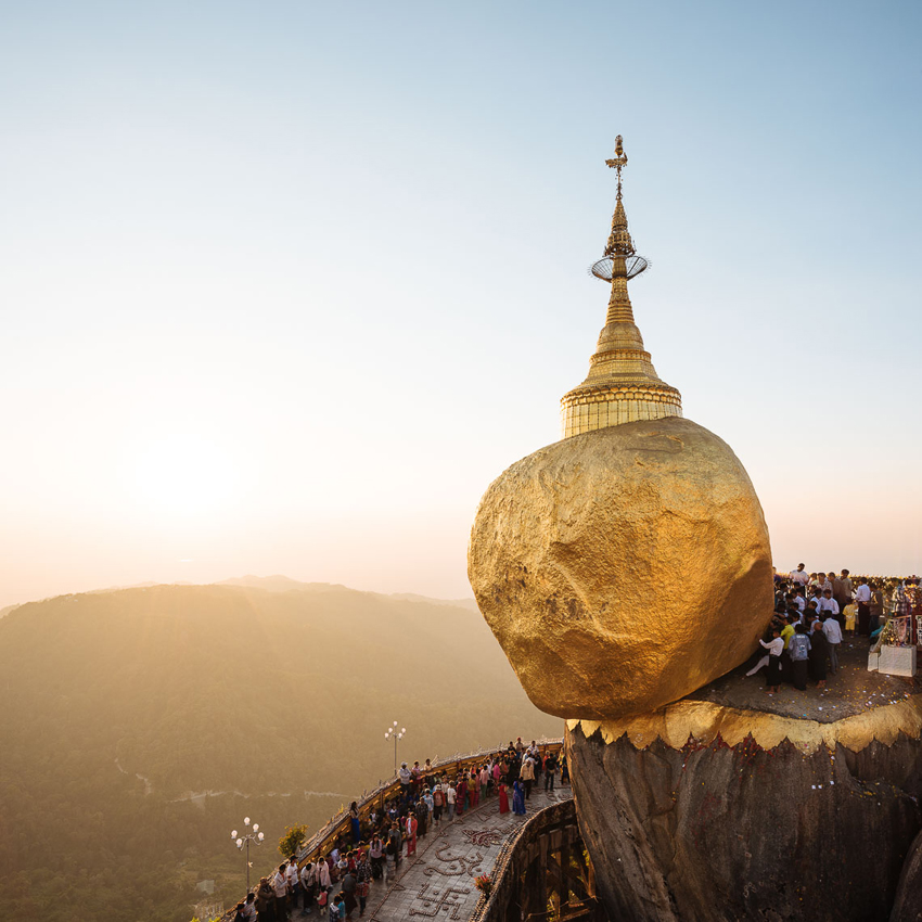 A photo of a golden shrine atop a boulder painted gold in Myanmar shot by Ben Pipe.