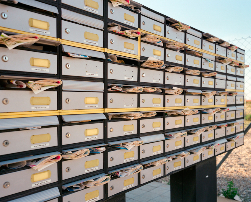 Mail boxes full of mail, shot by Markel Redondo.