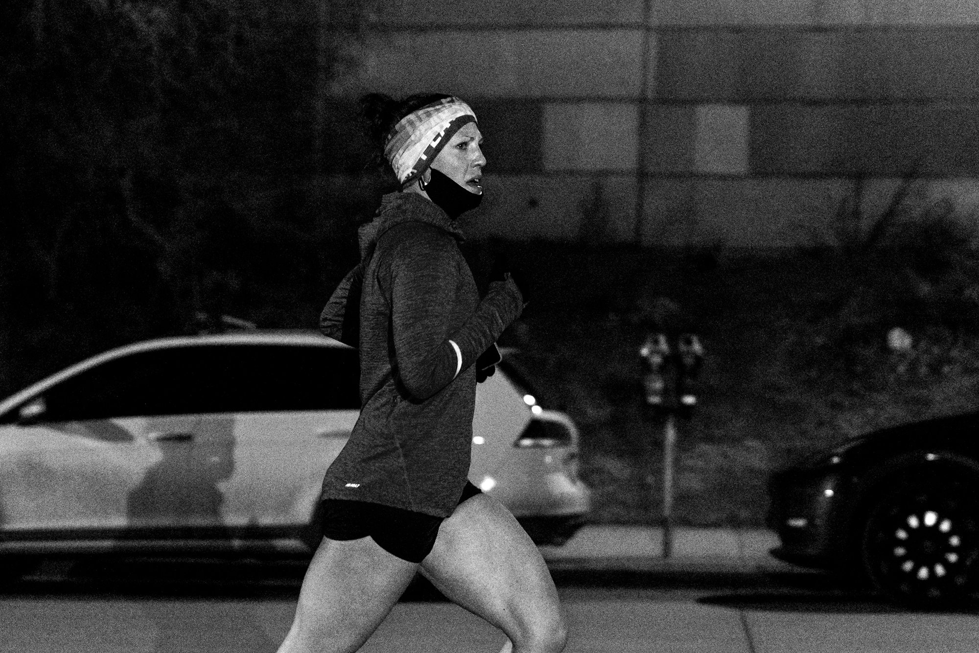 Matt Trappe photographs female runner in the dark for TTB in Denver
