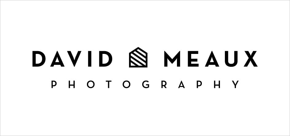 Another logo sample showing the photographer's first and last name separated by a visual of a house with lines through it
