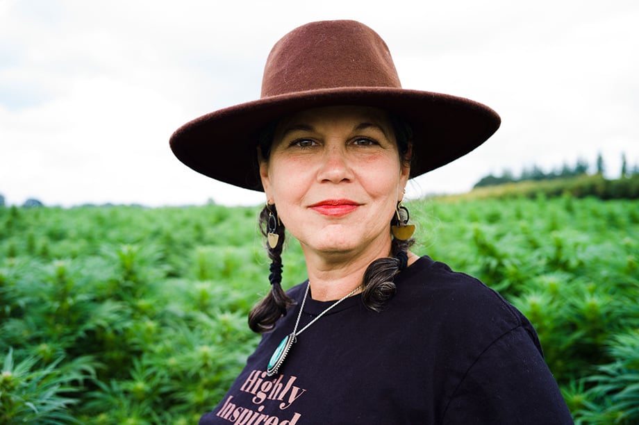 Portrait of Make & Mary founder Yvonne Perez Emerson in a hat. Photographed by Richard Darbonne.