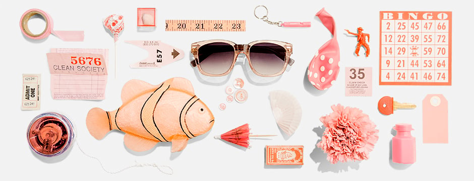 Sunglasses surrounded by other peach-colored items shot by Greg Vore photograph for Warby Parker, peach color scheme