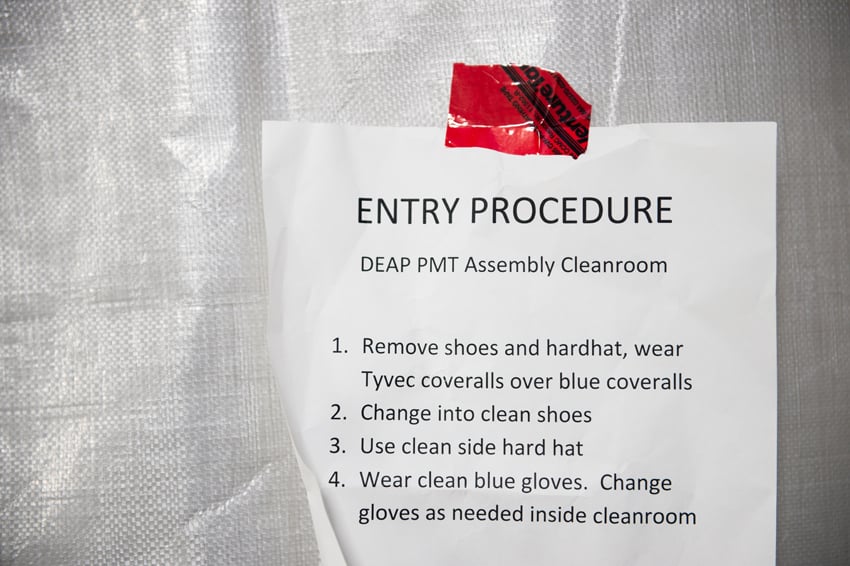 Luther Caverly's photo for Carleton University of a piece of paper that says "ENTRY PROCEDURE," and outlines the process for cleaning up before entering the lab.
