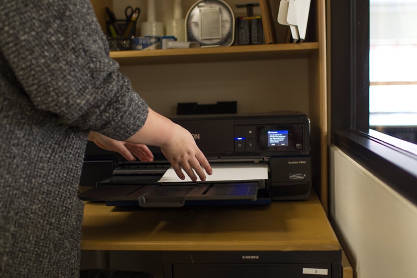 Wonderful Machine photo editor Molly Glynn loads paper into Epson P800 printer