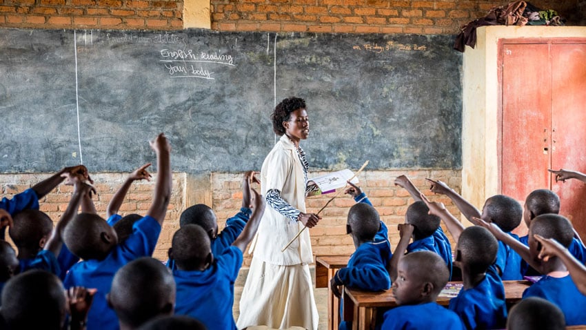 Students participating in class, in a Rwandan school, shot by Alex Buisse.