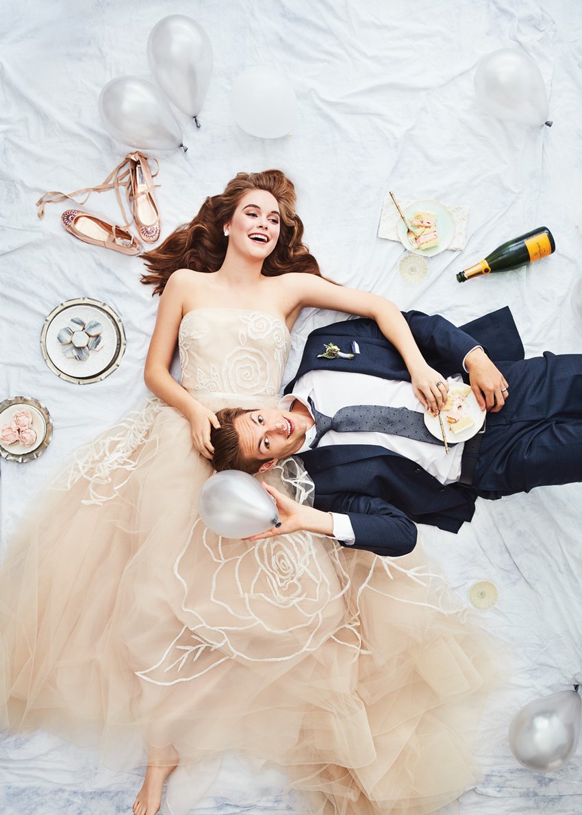 This heartwarming image captures the bride and groom lying side by side. Photo by Ashley Gieseking.