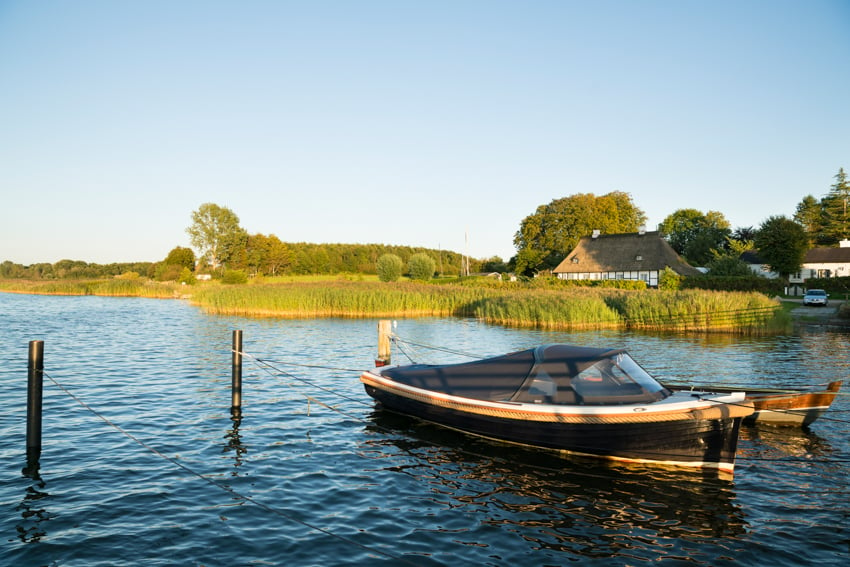 Photo by by Carsten Behler of a small boat docked on the Schlei for Landlust Magazine.