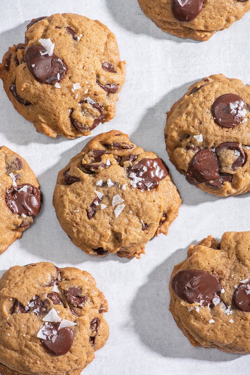 Baked chocolate chip cookies garnished with large salt flakes