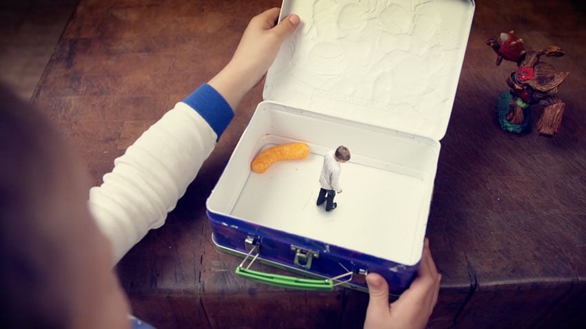 Conceptual photography showcasing a miniature person inside a lunchbox, photo by Clark Vandergrift.
