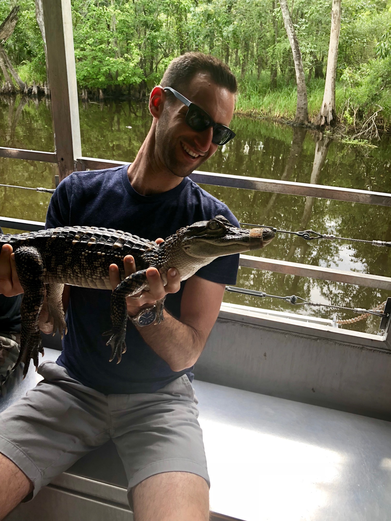 Behind the scenes of shoot production for Coors Light in New Orleans, producer Craig Oppenheimer petting an alligator. 