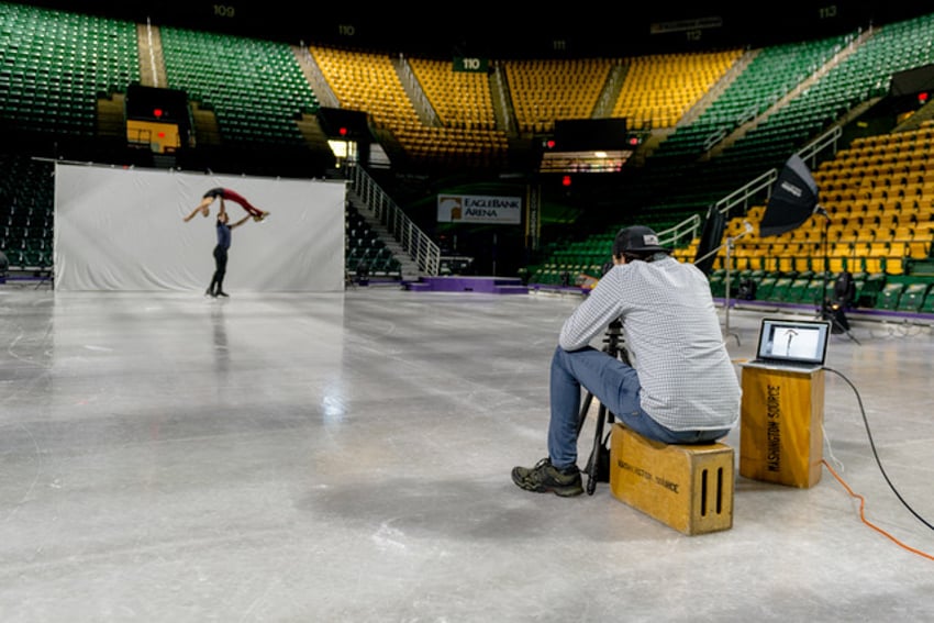 BTS photograph of ice skaters being photographed by Geo Rittenmyer for Disney on Ice.
