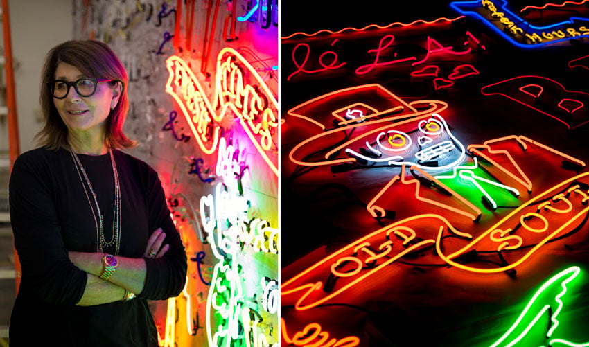 A portrait of Lisa Schulte alongside some neon signs, photo by Jeff Berting.