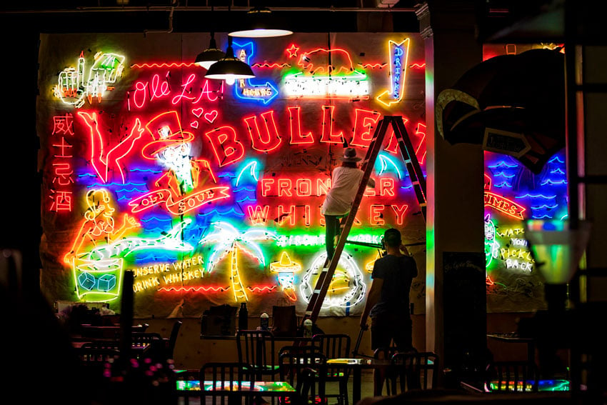 A wall of neon signs for Bulleit Whiskey, photo by Jeff Berting.