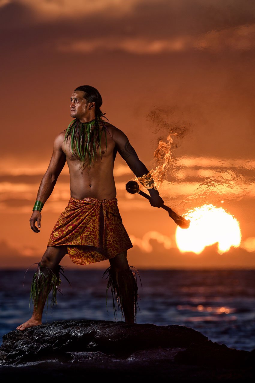 A Hawaiian knife dancer on the beach at sunset, photo by Joe McNally. 