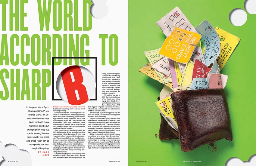 A tear sheet for Advertising Age featuring the photographic work of John Kuczala. The photo, on the right, features a worn out dark leather folding wallet packed full with an array of colorful loyalty cards which are spilling out of it.