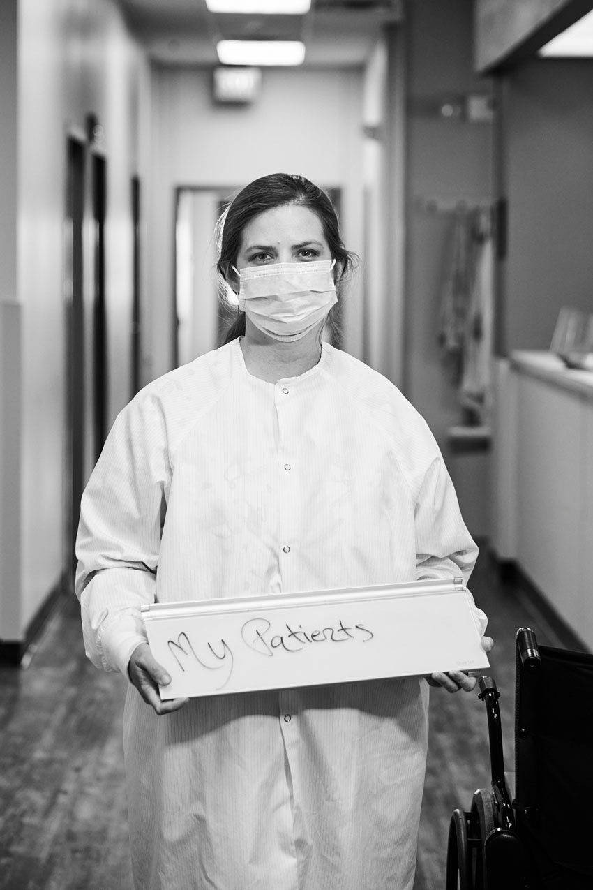 Jon Morgan's photo of a nurse, wearing PPE and surgical mask, holding a sign saying her biggest fear is "my patients."