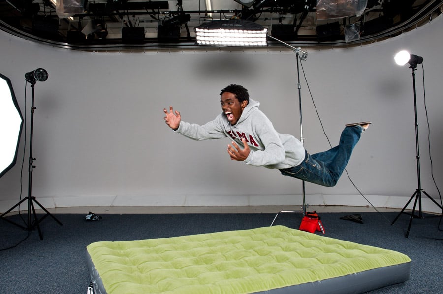 Student mid-air above an air mattress shot by Columbia, S.C.-based concept photographer James Quantz Jr for SUPe Store 