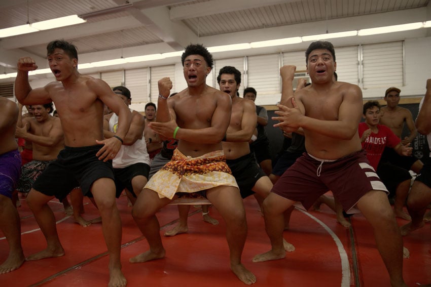 Football players dancing haka, a Polynesian war dance, photo by Marc Garcia.