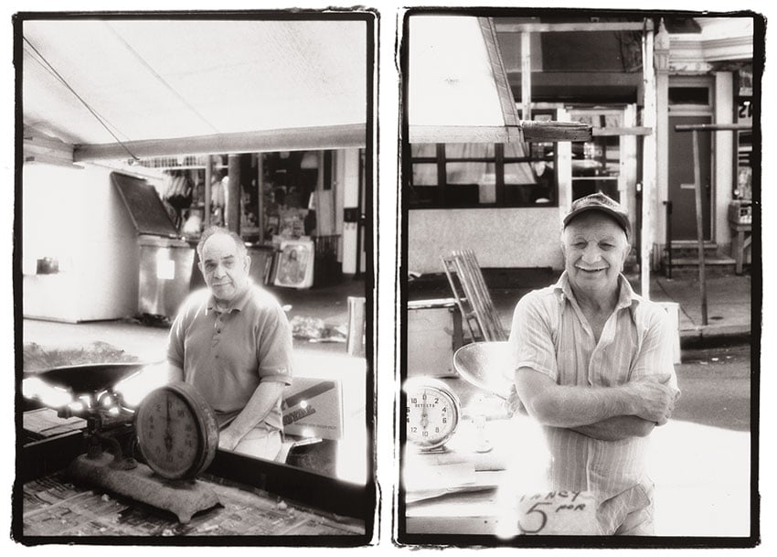 A diptych of photos by Nashville-based photographer Mark Boughton from Philadelphia's Italian Market. The black and white portraits each feature a man standing outside in the market. Both men are elderly.