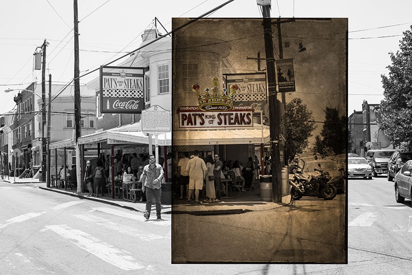 Nashville-based photographer Mark Boughton's photo from Philadelphia's Italian Market. The black and white photo features a street view of the restaurant Pat's King of Steaks. The restaurant is busy with people. 