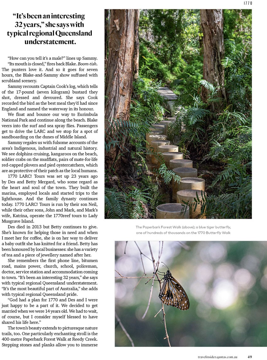 A tear sheet for Qantas Travel Insider featuring 2 photos by photographer Mark Lehn. Above is a photo of Paperbark Forest Walk. It features a winding path between two trees through the center of the shot with tropical-looking foliage all around it. Below is a picture of a blue tiger butterfly. It is a black butterfly with white spots and hints of orange.