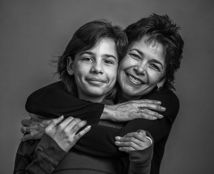 A portrait of a mother and a child, shot by Michael Schoenfeld.
