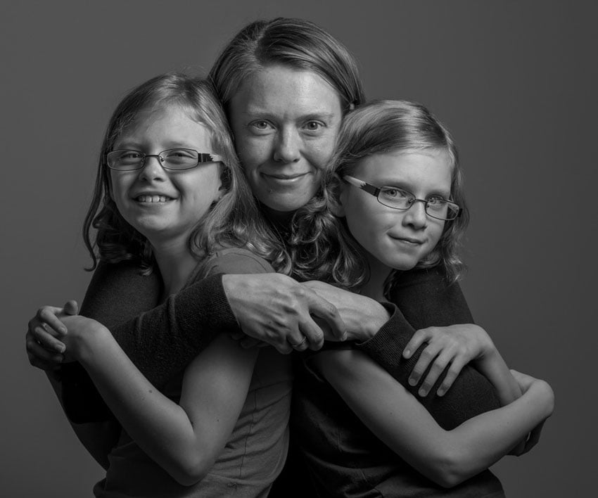 Portrait of a mother and her two daughters, shot by Michael Schoenfeld.