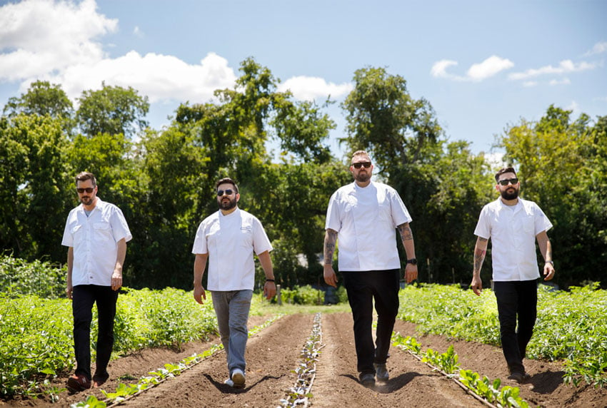 Lifestyle image of four chefs shot on a farm in Austin, photo by Nader Khouri.