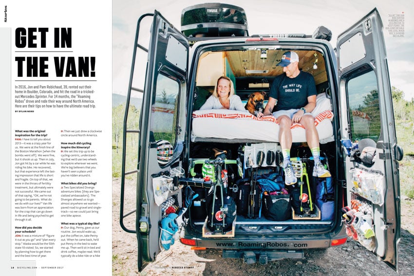 A tear sheet for Bicycling Magazine by Rebecca Stumpf. The tear sheet features one image of Jon and Pam Robichaud sitting atop their bed inside their customized van with the van's doors opened wide. Pam lies on her stomach and smiles out to her right and Jon sits on the edge of the bed with his legs dangling off the side and smiles at his dog, a Boxer, who lies between the two. The inside of the van features a wooden ceiling, and underneath the couple's bed are stored all of their biking equipment.  