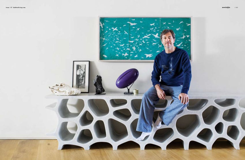 Tear sheet of a portrait photo of Marc Newson in his home.