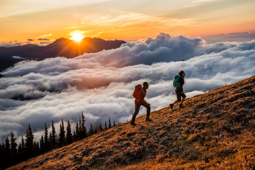 Two people hiking on a mountain, photo by Stephen Matera.