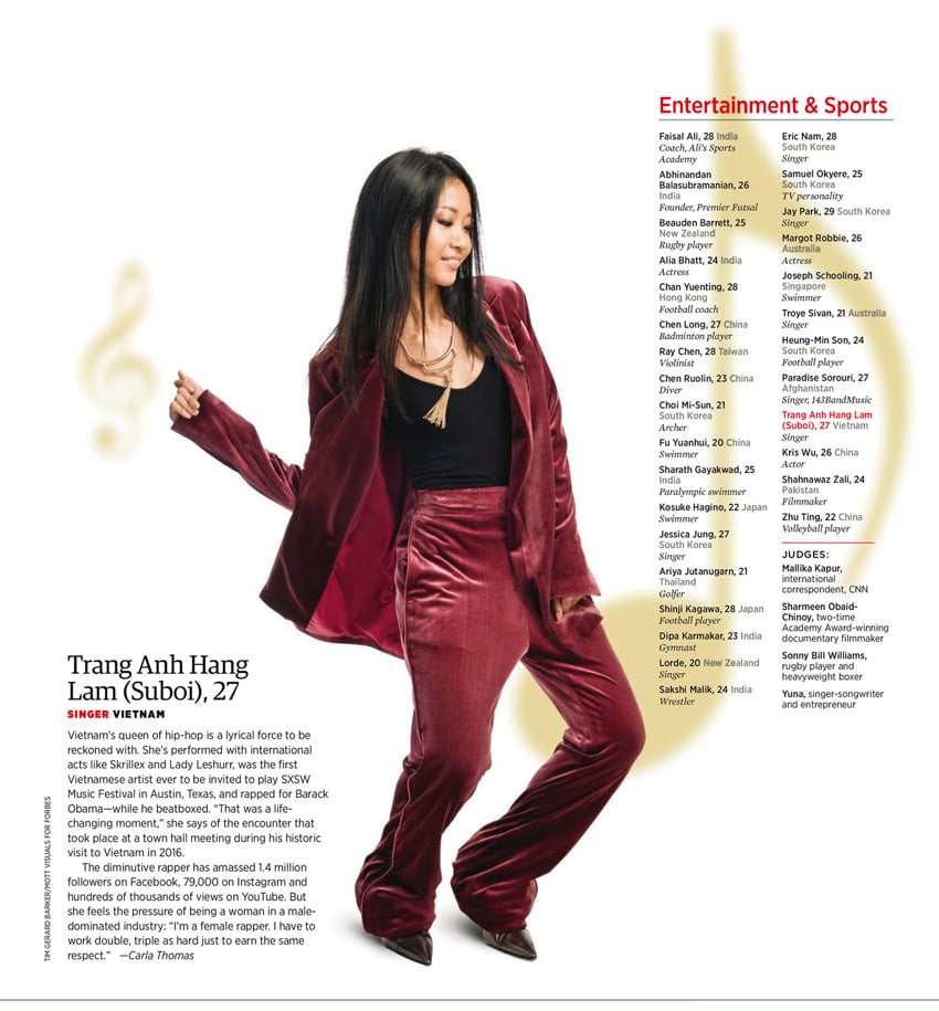 Tear sheet by photographer Tim Gerard Barker for Forbes Asia. The tear sheet features a portrait of Vietnamese singer Trang Anh Hang Lam. She wears a crimson velvet suit with an interesting gold statement necklace with a large tassel. She appears to be dancing.