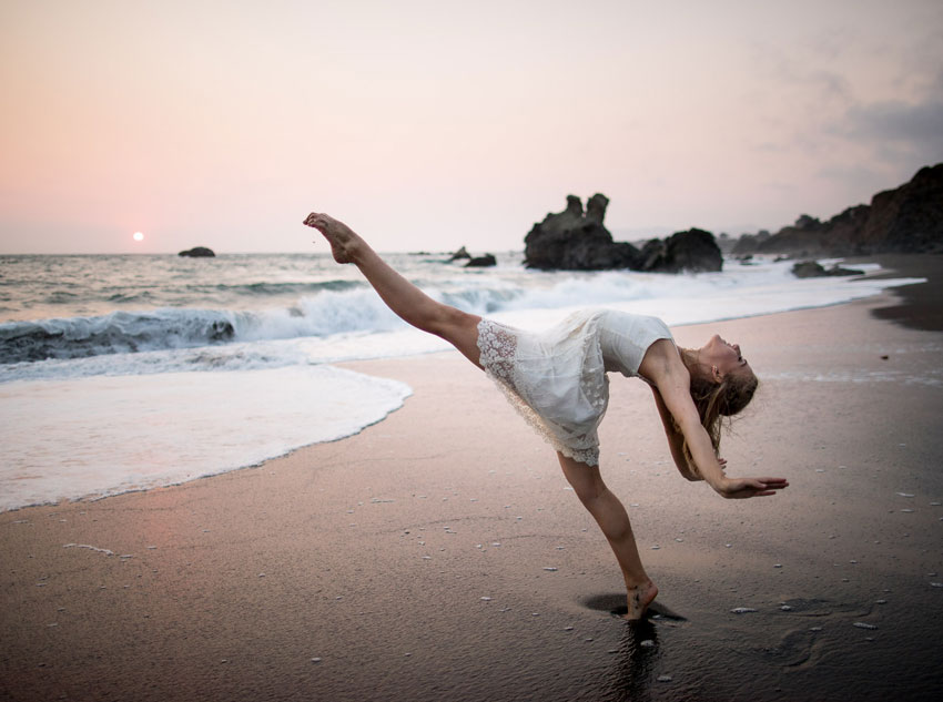 A ballet dancer posing on the beach, photo by Tyler Chartier.