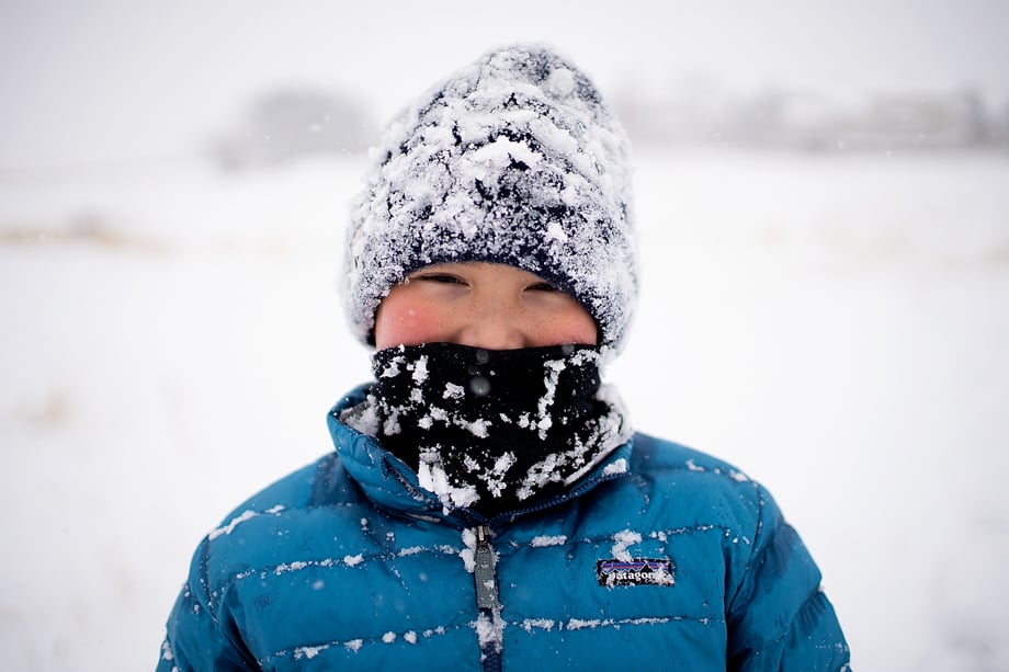 Child wearing Patagonia jacket covered in snow for CIP Winter Wonderland by photographer Kirk Irwin, Westerville, Ohio. 