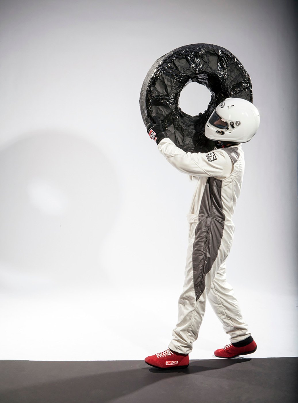 Studio shot of model carrying dummy tire shot by John Fulton for HondaJet Wings campaign.